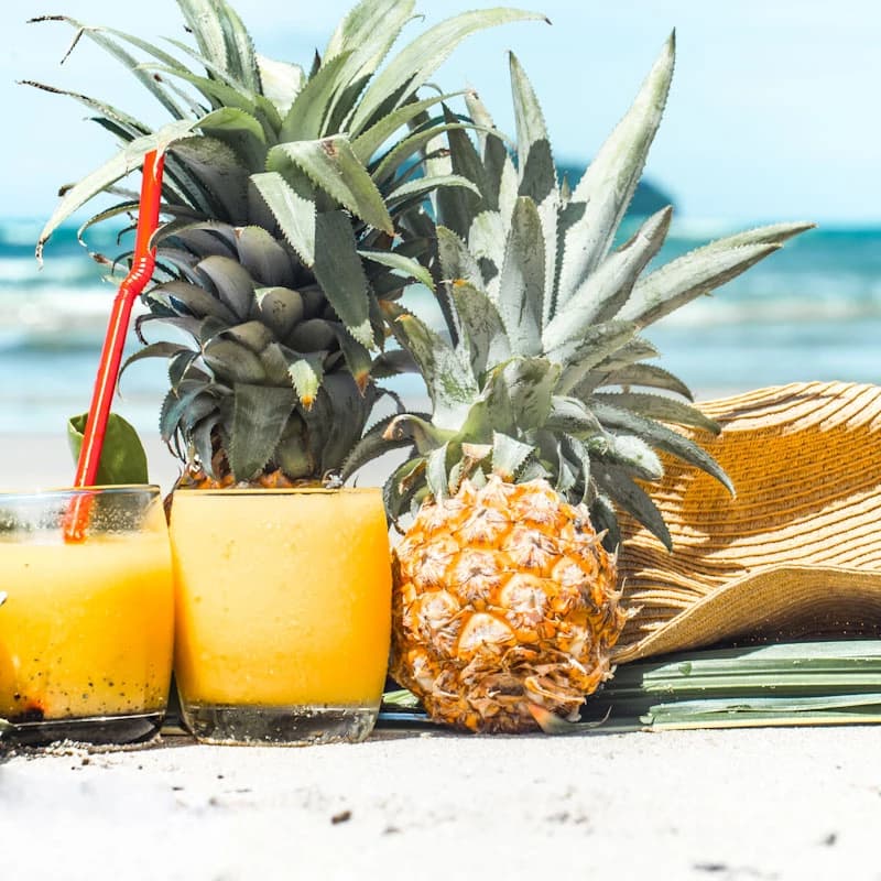 Piña Colada Cocktail in a hurricane glass with pineapple garnish